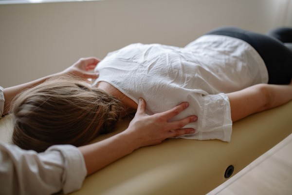 Woman preparing for massage treatment